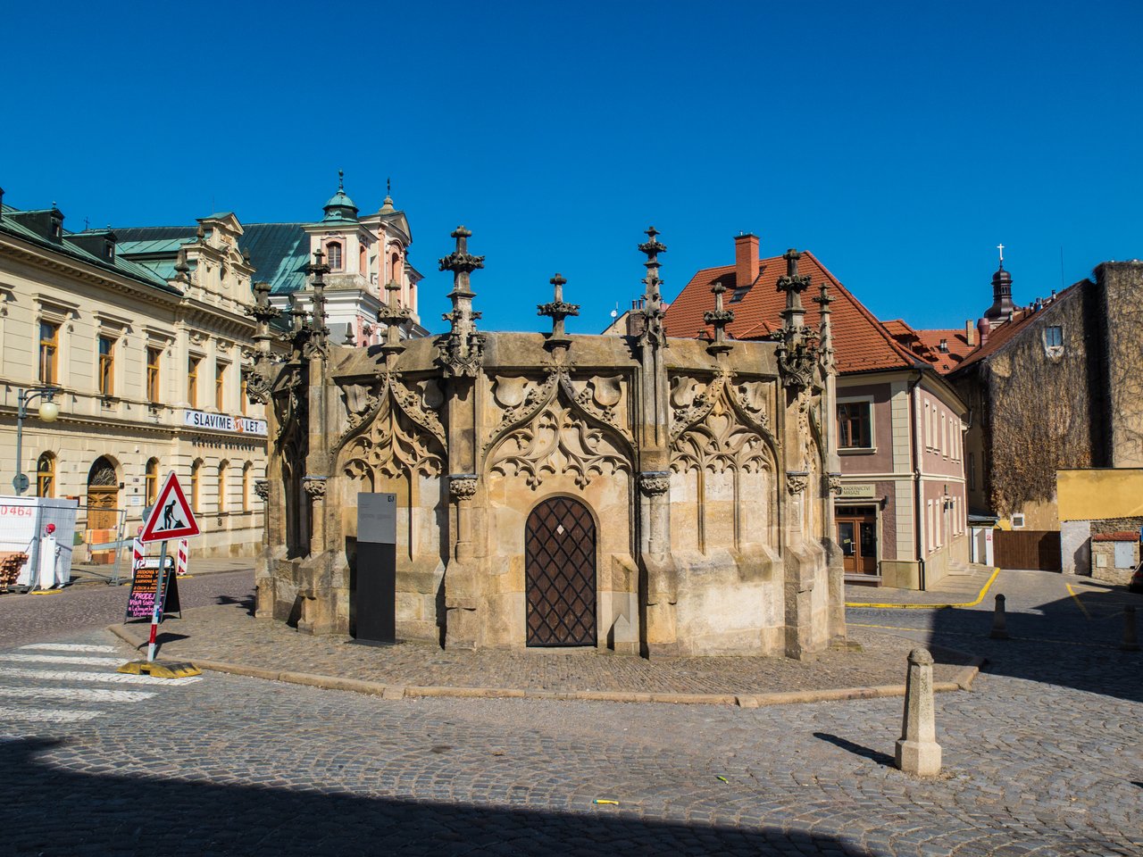 A sculpted stone structure, in the Gothic style with chiseled spires,